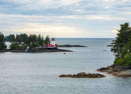 Light house on the rocks on island in the bay of Sitka in Alaskaの写真素材