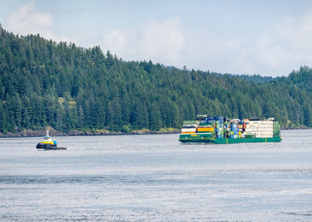 Campbell River, BC - 11 June 2022: Containers stacked on Alaska Marine Lines barge in Discovery Passageのeditorial素材