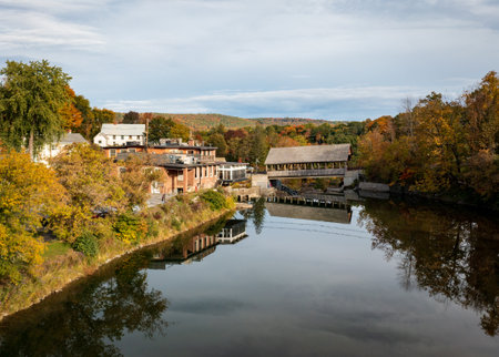 Ottauquechee river flows under Quechee Covered Bridge in Vermontの写真素材