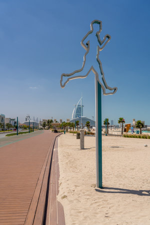 Jogging sign for the green running track at Jumeirah public beach in Dubai UAEの写真素材