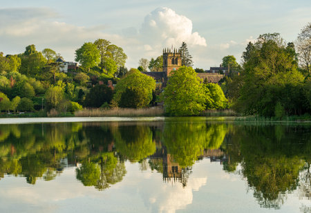Town of Ellesmere in Shropshire with reflection view from across the Mere to the Churchの写真素材