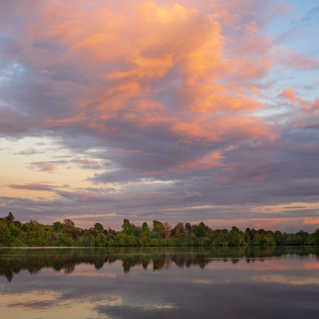 Sunset panorama of the lake shore of the Mere with a perfect lake reflection in Ellesmere in Shropshireの写真素材