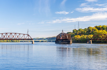 Dubuque Railroad bridge opens to allow river cruise boat to pass on Upper Mississippi in Dubuque Iowaの写真素材