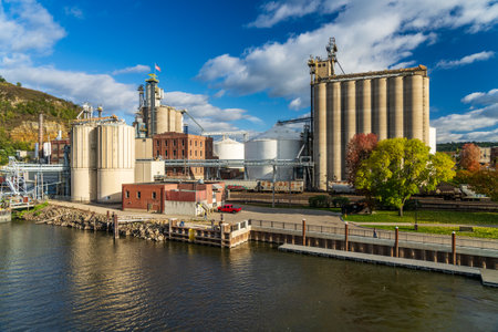Red Wing, MN - 15 October 2023: ADM food processing and storage plant in the town in Minnesota seen from Mississippi riverのeditorial素材