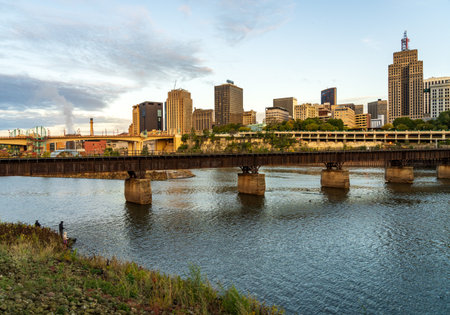 St Paul, MN - 14 October 2023: Early morning cityscape of Twin Cities in Minnesota and Mississippi river with railroad bridgeのeditorial素材