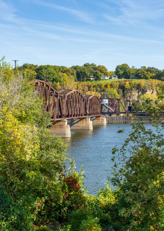 Historic Dubuque railroad bridge between Iowa and Illinois across the Mississippi river with swing span open for shippingの写真素材