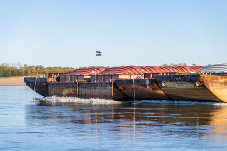 Close up of the bow of freight barges on the calm waters of the Mississippi river during low water conditionsの写真素材