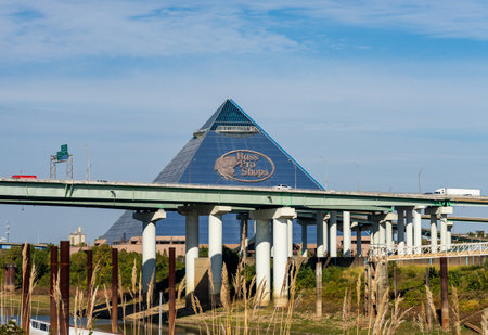 Memphis, TN - 23 October 2023: Hernando de Soto bridge and Memphis Pyramid housing Bass Pro Shops in Tennesseeのeditorial素材
