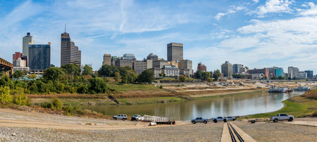 Panoramic view of Memphis Tennessee cityscape with low water levels in the Wolf River Harbor and slipway only just reaching the waterの写真素材
