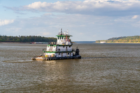 Natchez, MS - 26 October 2023: Tug Boat Jean Marie sails towards incoming steam paddleship on...