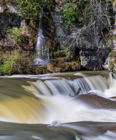 Small waterfall cascade on rocks by Valley Falls State Park near Fairmont in West Virginia on a colorful and bright spring dayの写真素材