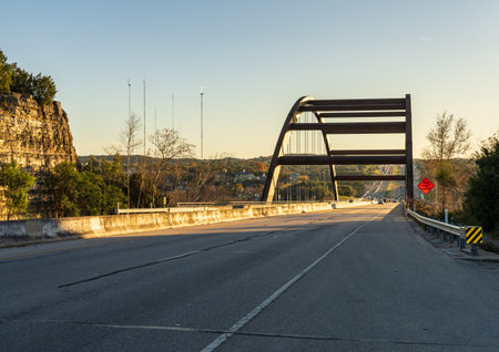 Pennybacker suspension bridge or 360 Bridge over Colorado River from roadway near Austin TXの写真素材
