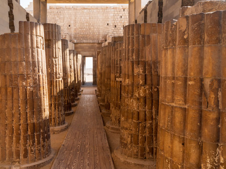 Series of large stone columns in the entrance court to the Stepped Pyramid of Djoser in Egyptの写真素材