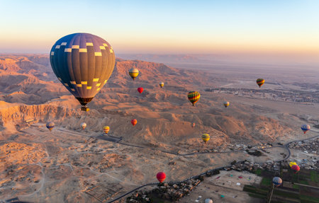 Hot-air balloons over Temple of Hatshepsut at Deir el Bahari and Valley of Kings near Luxor, Egpytの写真素材