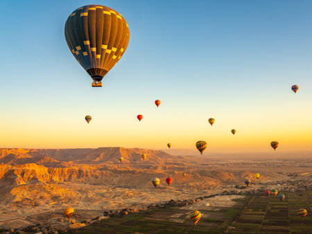 Hot-air balloons over Temple of Hatshepsut at Deir el Bahari and Valley of Kings near Luxor, Egpytの写真素材
