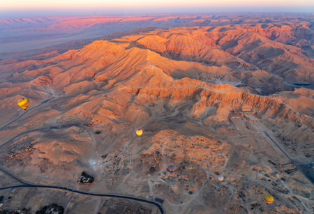 Hot-air balloons over Temple of Hatshepsut at Deir el Bahari and Valley of the Kings near Luxor, Egyptの写真素材