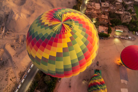 Inflating hot-air balloons for flight over Sahara desert and Valley of Kings near Luxor, Egpytの写真素材