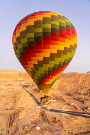 Hot-air balloon over Temple of Hatshepsut at Deir el Bahari and Valley of Kings near Luxor, Egpytの写真素材