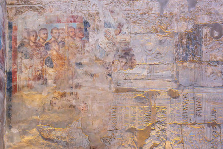 Ancient Roman fresco depicting a group of men in togas, possibly officials or dignitaries, with faded details showing older Egyptian carvingsの写真素材