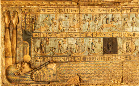 Restored ceiling painting with one panel left in its original dirty and uncleaned state in the temple of Hathor at Denderaの写真素材