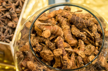 Glass jar of turmeric, or Curcuma longa, is a flowering plant in the ginger family Zingiberaceae in Egyptの写真素材