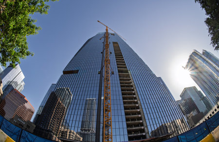 From below fisheye lens view of The Republic building in downtown Austin Texas in springの写真素材