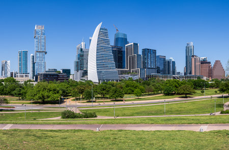 Broad panorama of the office and apartment buildings of Austin Texas skyline from Town parkの写真素材