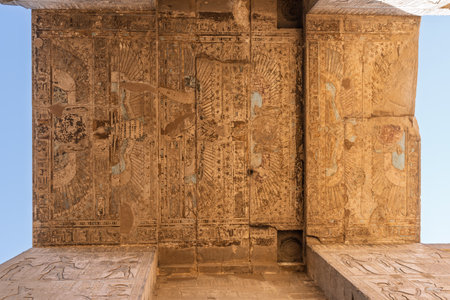 Detail of the carved images on the sides and roof of the massive temple in Edfu dedicated to Horus and Hathorの写真素材