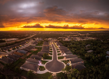 Aerial view of a dramatic sunset lighting clouds before severe thunderstorm near Georgetown Texasの写真素材