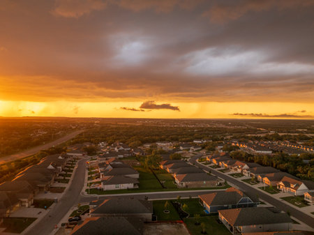 Aerial view of a dramatic sunset lighting clouds before severe thunderstorm near Georgetown Texasの写真素材