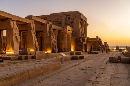 Magnificent temple of Sobek and Horus at Kom Ombo as the sun sets over the river Nileの写真素材