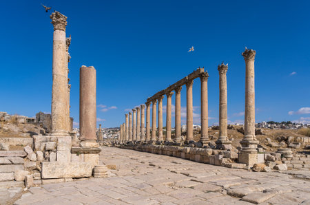 Columns line the Cardo Maximus, the main street in Jerash, a Greco-Roman well preserved city in...
