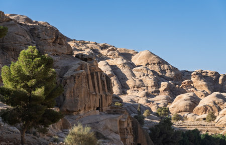 Obelisk Tomb burial caves in the Necropolis hills on walk from entrance to As Siq in Petraの写真素材