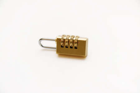 Iron combination lock with numbers on a white background. Gold combination lock with numbers 7777