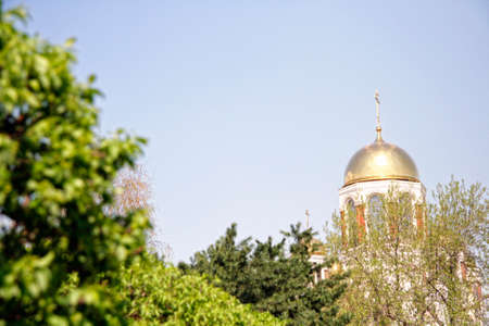 golden dome of the temple against the background of sky and green trees Temple on Blood in...