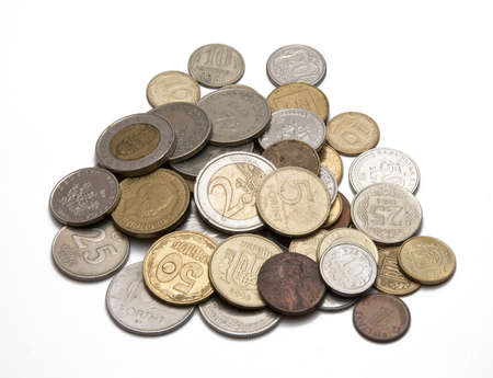 coins from different countries on a white backgroundの写真素材