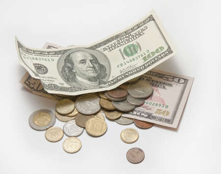 dollars and coins of different countriesの写真素材