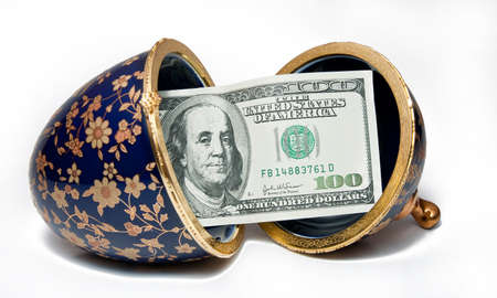 $ 100 in a ceramic eggの写真素材
