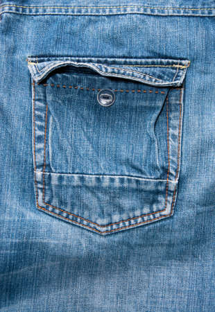 blue jeans, an open pocket with a buttonの写真素材