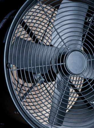 big black metallic fan close-up as a backgroundの写真素材