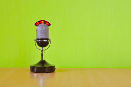 microphone stands on the table, the green wallの写真素材