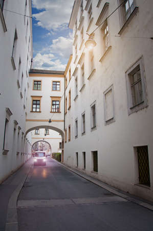 the car goes through the old town in Viennaの写真素材