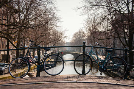 Bicycles parked on a bridge in Amsterdam