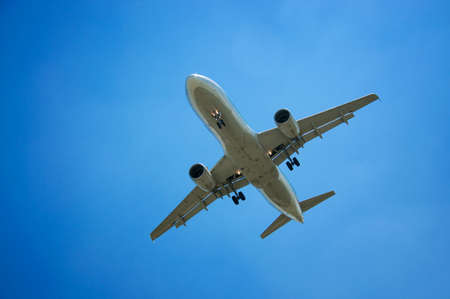 plane on a background of the sky with cloudsの写真素材