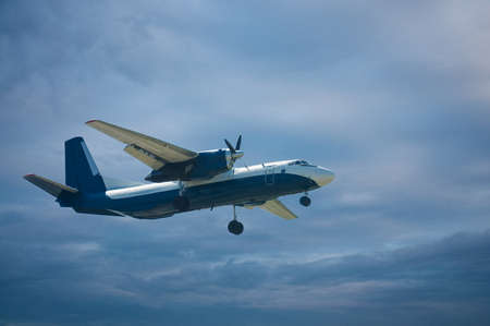 plane in the blue sky with clouds