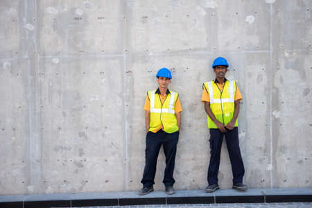 DUBAI, UAE - 3 MARCH, 2014: Two workers have a rest on the construction in Dubai. March  3, 2014 Dubai, UAE.のeditorial素材