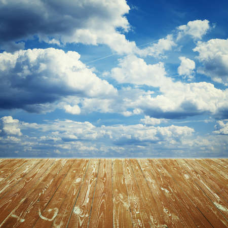 brown wooden floor against the skyの写真素材