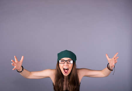 screaming woman on a gray background