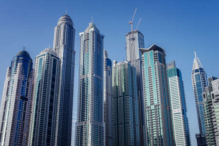 DUBAI, UAE - 3 MARCH, 2014: Modern skyscrapers in Dubai Marina, close up, in Dubai, UAE. Here is the...