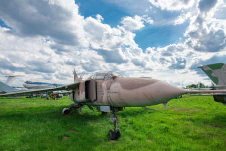 Military fighter plane on green grass